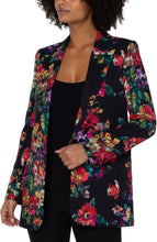 Load image into Gallery viewer, The Tamera is sure to make a statement while bringing a blend of sophistication and style. Whether needing a polished look for the office or a casual look for a day out, this versatile style is ideal. The luxurious fabric on the inside provides a soft feeling to wear all day long. Its single-button closure creates a modern and simplest design.  Color -Bouquet Floral Print- Black with shades of pink, blue, yellow, green, purple, red and white.
