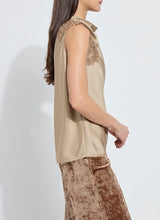 Load image into Gallery viewer, Woman wearing a beige sleeveless top with lace details and brown velvet pants against a white background.
