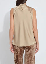 Load image into Gallery viewer, Woman wearing a beige sleeveless top with lace detail and brown velvet pants against a white background.
