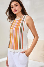 Load image into Gallery viewer, Woman wearing a sleeveless striped top and white pants against a neutral background.
