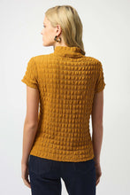 Load image into Gallery viewer, Woman wearing a textured golden mustard yellow top and jeans against a white background.
