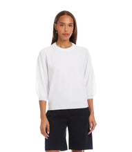 Load image into Gallery viewer, Woman wearing a white sweater and black shorts on a white background.
