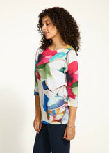 Load image into Gallery viewer, Exude confidence in this striking drop shoulder boat-neck top in a brilliant abstract floral pattern. Crafted from drapey twill, the relaxed fit provides unparalleled comfort. Its flattering silhouette effortlessly complements any look, whether it be with distressed denim or tailored twill.
