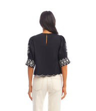 Load image into Gallery viewer, Add a touch of timeless elegance to your wardrobe with the Tesni Three Quarter Sleeve Embroidered Scallop Top by Karen Kane. Featuring delicate floral embroidery, a scalloped hem, and chic puff sleeves, this sophisticated blouse offers a graceful yet modern look for any occasion. Perfect for brunch, workdays, or an evening out, this lightweight embroidered top pairs effortlessly with jeans, skirts, or tailored pants.
