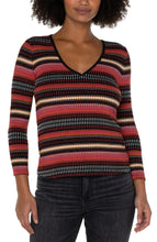 Load image into Gallery viewer, This three-quarter sleeve V-neck top features contrast striping in versatile colors of black, yellow gold, rose pink, and white. The fabrication has a silky high-quality substantive feel with great stretch. Our Tori is an ideal style to wear on its own or under a blazer, jacket, or cardigan for a polished look. Complete the ensemble with black trousers or blue jeans.  Colors- Black, white, rose pink and yellow gold. Three quarter sleeves. V-neck. Contrast striping.
