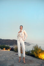 Load image into Gallery viewer, Crafted from woven denim, our Olympia off-white, sequin hem denim pant offers a sleek, structured fit that’s both comfortable and flattering. But the real standout? The shimmering sequin hem that catches the light with every step, adding a touch of glam and sophistication to your look. Whether you pair them with a chic blouse for an elegant evening ensemble or a tailored blazer for polished daywear, these pants promise to elevate your style effortlessly.
