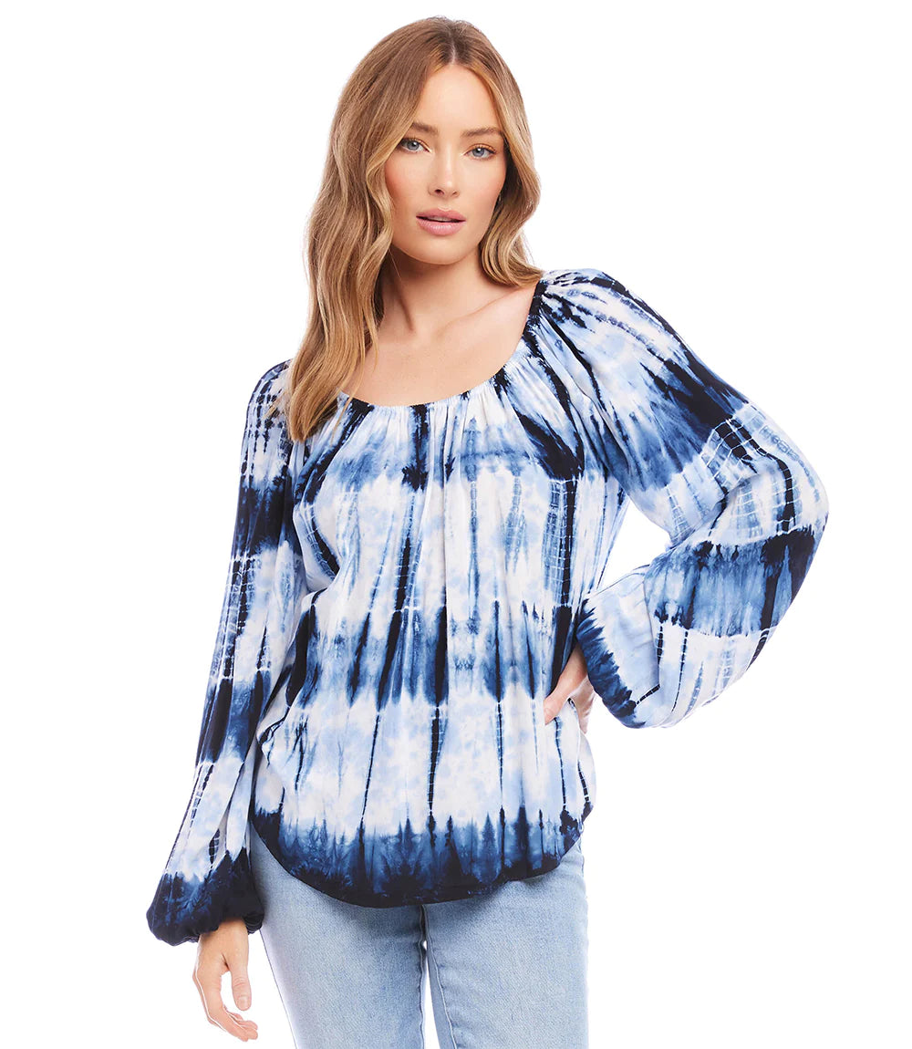 Feminine and modern, this tie-dye watercolor print on this woven top is striking in colors. Our romantic Thea top is detailed with statement-making blouson sleeves. This beautiful top really pops when paired with white bottoms. Color - Tie dye; blue and white. Blouson sleeve. Scoop neck. Unique dye treatment used. Colors and design may vary. Fabric - 100% Rayon.