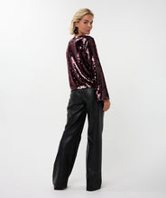 Load image into Gallery viewer, Woman wearing a maroon sequin blouse, black pants and black flats against a white background.

