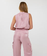 Load image into Gallery viewer, Sleek, soft, and summer-ready—the Svea Halter Top brings effortless elegance to any warm-weather look. Crafted from EsQualo’s signature silky-touch fabric in a dreamy pastel pink, it features a halter neckline with delicate gathering and a flowing, relaxed silhouette. Lightweight and breezy, it’s perfect for layering under a blazer or pairing with the matching silky cargos for a chic tonal ensemble.
