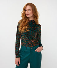 Load image into Gallery viewer, Woman wearing an animal print top in burnout velvet in teal and brown and teal pants against a white background.
