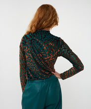 Load image into Gallery viewer, Woman wearing an animal print top in burnout velvet in teal and brown and teal pants against a white background.
