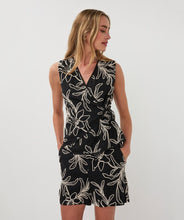 Load image into Gallery viewer, Woman wearing a black sleeveless top with off-white floral embroidery and matching shorts against a white background.
