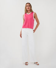 Load image into Gallery viewer, Woman wearing a pink sleeveless top with off-white trim and white pants on a plain background.
