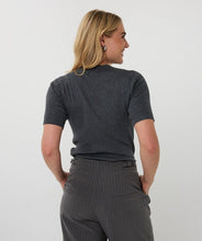 Load image into Gallery viewer, Woman wearing a dark gray sequin ribbed short-sleeve top and gray pinstripe pants against a white background.
