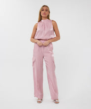 Load image into Gallery viewer, Slide into summer with these effortlessly chic silky cargos by EsQualo. Crafted in a soft pastel pink, they blend utility and elegance with a lightweight, flowy silhouette. Featuring an elastic waistband, side patch pockets, and a breezy wide-leg cut, these trousers are perfect for sunny strolls, weekend getaways, or dressing up with a strappy heel.
