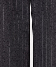 Load image into Gallery viewer, Close-up of dark gray pinstripe pants against a light gray background.
