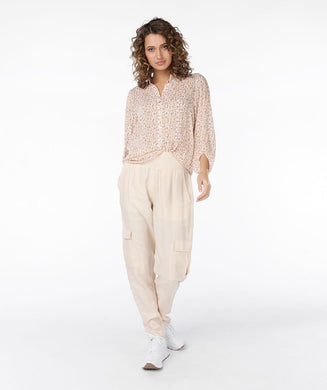 Experience ultimate comfort with our light sand colored cargo pants featuring an elastic waist band. The fabric is cool to the touch, ensuring a comfortable and stylish look. Dress up with wedges or heels or create a casual vibe with a pair of sneakers. You will absolutely love the feel of these Tana trousers.