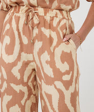 Load image into Gallery viewer, The EsQualo Trousers Solar Swing are stylish and comfortable pants featuring an all-over print design, wide legs, and side pockets for functionality. They come with two welt pockets at the back and an elastic waistband with a drawstring, accented with gold beading for a chic touch. A perfect pant for warm days, the Toma offers a lightweight and breathable fit.
