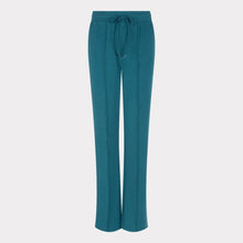 Load image into Gallery viewer, Teal pants against a light gray background.
