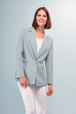 Elevate your wardrobe with the Bennett Blue Turquoise Woven Blazer from Insight New York. The classic houndstooth fabric is adorned with sparkly rhinestones, giving a unique twist to the classic blazer. Perfect for making a statement and exuding confidence. Features long sleeves, lapel collar, and single button closure.