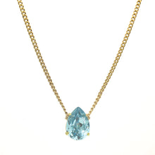 Load image into Gallery viewer, Introducing the Lumi necklace, a dazzling and versatile piece adorned with a high quality pear-shaped stone in the middle. This antique gold-plated necklace features a 14” length with a 3” extension. Handcrafted in Canada.    Color- Gold and turquoise. Premium crystals. Tear drop in turquoise. Gold chain. Length- 14 inches with 3-inch extension. 

