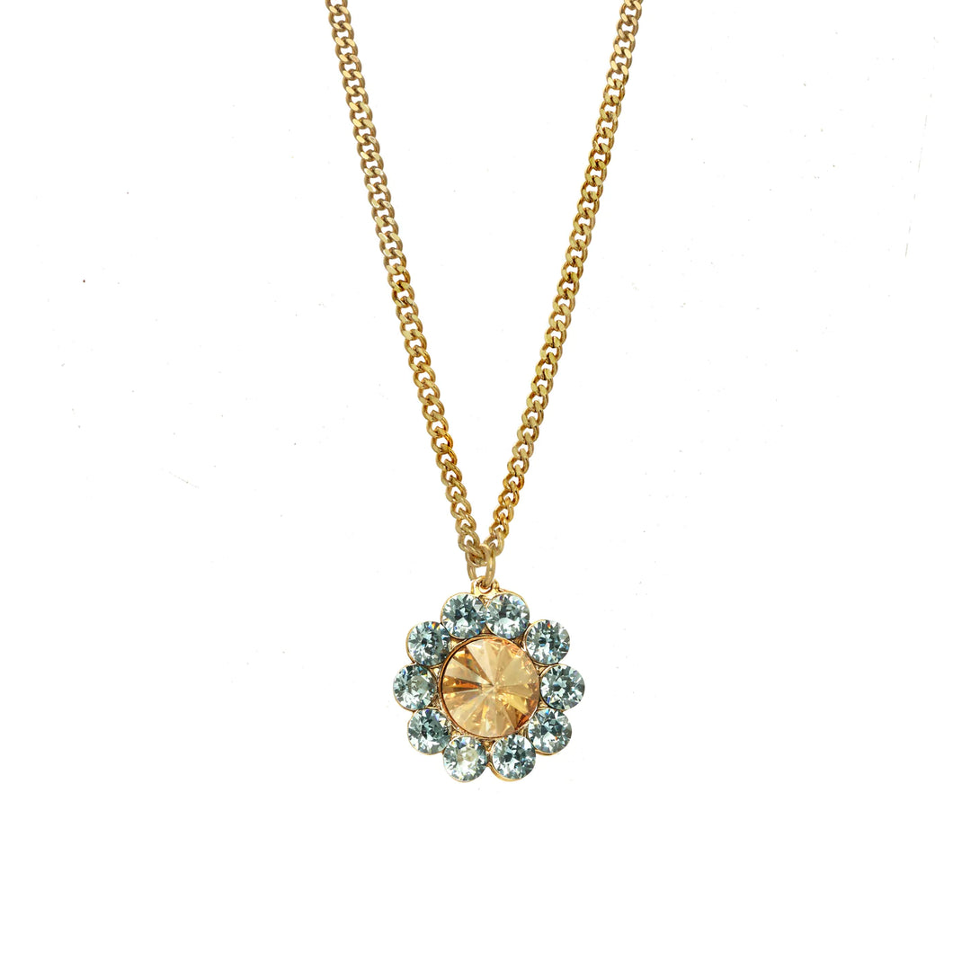Show off your shimmering style with the Twiggy Necklace in Aqua and Champagne! This floral design necklace from Canadian makers is designed with an antique gold-plated brass base metal and adorned with high-quality crystals. You'll turn heads and be ready to shine when you style this beautiful piece.  Color- Aqua, champagne, gold. Premium crystals. Antique gold plating over brass. Length- 19.5 inches with two-inch extender.