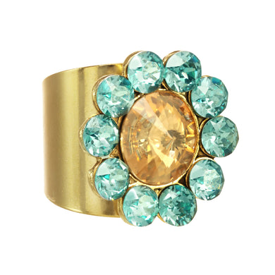 Add a glamorous touch to your style with the Twiggy Ring. This beautiful piece is crafted with superior crystals in an exquisite aqua and champagne color palette. The antique gold-plated brass and pewter base metal finish the piece off for a stunning look. Additionally, its adjustable fit ensures a comfortable wear.  Color- Aqua, champagne and gold. Premium crystals. Antique gold plating over pewter base metal. One size, adjustable.