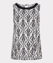 Load image into Gallery viewer, This black and white top features an elegant sleeveless design with a delicate bow at the back and beaded neckline. Perfect for wearing on its own or layering with a jacket or blazer. Experience the timeless chic of an ikat print with this stunning top.
