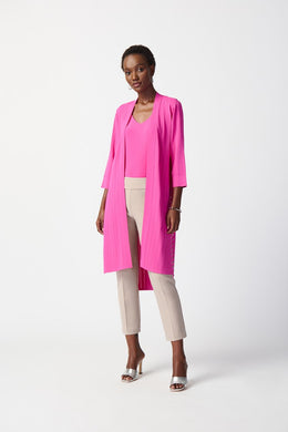 This stylish cover-up/cardigan features extended side openings and flared sleeves that impart a sense of fluidity and grace while in motion. The decorative studs along the openings add a touch of bold sophistication, making it perfect for both professional and casual settings.  Color- Ultra pink. Drape silhouette. No pockets. No zipper. Not lined. Side splits lined with silver hardware.