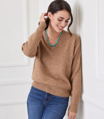 Cozy up in this soft V-neck sweater. Perfect for lounging or a casual day out. A wardrobe staple that's anything but basic.