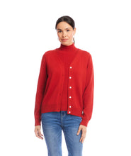 Load image into Gallery viewer, Woman wearing a red cardigan over a coordinating turtleneck and blue jeans against a white wall.
