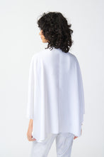 Load image into Gallery viewer, Our woven wrap top is a must-have garment that exudes confidence and grace. With dolman sleeves and a pleat detail at the neck, this top brings versatile style to your wardrobe, draping gracefully to flatter every body type.  Color- Vanilla. Woven fabric. Wrap neckline. Dolman sleeves. Pleated detail at the neck. Unlined.
