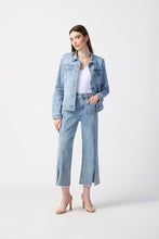 Load image into Gallery viewer, This darling denim jean is a must-have for any wardrobe. With practical pockets and a sparkling embellished front seam, it exudes sophistication and style. The eye-catching slit and frayed hem add a unique edge to the design. Perfect for any occasion, these pants are both stylish and functional.  Color - Light blue. Denim. Four pockets and embellished front seam. Unlined.

