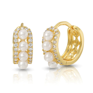 Glamorously stylish! Crafted with care, these 18K gold filled huggies feature a single row of white pearls, framed by cubic zirconia on either side.  Color- White, gold and clear. Cubic zirconia. White pearls. 18k gold filled. Diameter 15mm. 6mm thick.