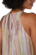 Load image into Gallery viewer, Beautiful pastel watercolor hues stand out beautifully on this statement making top.  A feminine halter style will effortlessly take you from day to evening events.  Pairs beautifully with neutral trousers or denim.  Color- Watercolor print; Pinks, greens, lilac, tan. Sleeveless. Mock neck. Button back closure. Liverpool Exclusive print.
