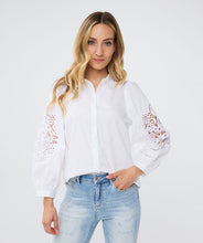 Load image into Gallery viewer, The Wita White Blouse Lace Sleeve by EsQualo features a striking openwork design on its sleeves, making it a standout choice. Its classic white color allows for versatile pairing with a variety of pants and skirts.
