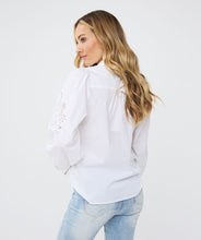 Load image into Gallery viewer, The Wita White Blouse Lace Sleeve by EsQualo features a striking openwork design on its sleeves, making it a standout choice. Its classic white color allows for versatile pairing with a variety of pants and skirts.
