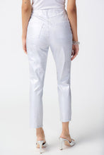 Load image into Gallery viewer, These high-quality denim jeans feature a classic and elegant design with a shimmering foil animal print. The slim crop silhouette provides versatility, while the hidden elastic waistband ensures comfort and security.  Color- White and silver. Foiled twill. Hidden elastic waistband. Two back pockets. Unlined.
