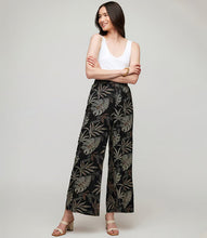 Load image into Gallery viewer, Channeling the free-spirited vibe of bohemian style, these soft pants boast a charming dotted leaf pattern that brings a whimsical flair to any outfit. Convenient side pockets and a wide-leg design provide both style and comfort, making them perfect for relaxed days at home or adventurous outings.
