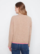 Load image into Gallery viewer, A woman shown from the back wearing a light beige knit sweater with bright pink contrast trim at the hem and cuffs, paired with blue jeans, against a plain white background.
