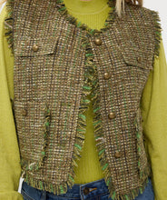 Load image into Gallery viewer, Our Gillian is a stylish and elegant piece designed to elevate your wardrobe. This gilet features luxurious lurex detail, adding a touch of sparkle to the boucle tweed fabric. It also includes frayed detailing on the hems and bronze buttons making it both fashionable and functional.
