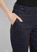 Load image into Gallery viewer, Model wearing dark plaid pants and black loafers against a white background.
