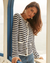 Load image into Gallery viewer, Experience comfort and style with this essential addition for a sophisticated appearance. Wear it unbuttoned over your preferred top or buttoned up for a refined look. The classic white and navy stripes offer a timeless appeal. Easily dressed up or down for any occasion. Color- White and navy stripe. Front button closure. Round neck. Long sleeves.
