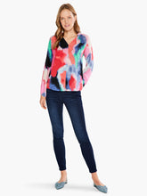 Load image into Gallery viewer, Be prepared to receive compliments when you wear this amazing top with its brilliant splashes of color.  The shaped V-neck and front seam contrasts with abstract pattern in bright colors, elevating the style. A soft, drapey fabrication offers a touch of femininity, while the elastic sleeves provide ease. A gorgeous style that pairs well with denim or your favorite white pants.   Colors- Pinks, coral, blues, greens. Easy fit.
