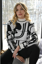 Load image into Gallery viewer, We are in love with this black and off-white contrast abstract design sweater.  As unique as it is beautiful, you will receive numerous compliments when you wear this fabulous style. Perfect color combination to essentially pair with any of your favorite bottoms.
