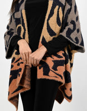 Load image into Gallery viewer, A striking abstract print in orange, black and brown comes alive on this stunning cardigan.  Fuzzy, cozy and warm, this fabulous cardigan will become your next cold weather favorite.  
