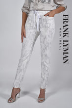 Load image into Gallery viewer, A true beauty, the Cora pant by Frank Lyman is not only fashionable but has such a beautiful feel.  A pull on with a drawstring, the subtle animal print in light gray sits atop a white background. Pair with a white tee or a silver/gray top and you will be able to conquer the day in comfort!

