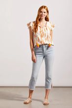 Load image into Gallery viewer, ur Silvia is a super stylish and undeniably comfortable straight-leg jean with a mid-rise fit.  The stand-out feature are the side slits at the hem emphasized with embroidered light orange and bright pink detailing. A perfect jean that goes with so many tops including our  Farah Flutter Sleeve Textured Blouse with Tassels by Tribal (pictured)  Color - Coastline; Light blue. Side slits with embroidery in light orange and bright pink. Mid-rise. Zipper and button closure. Functional front and back pockets.
