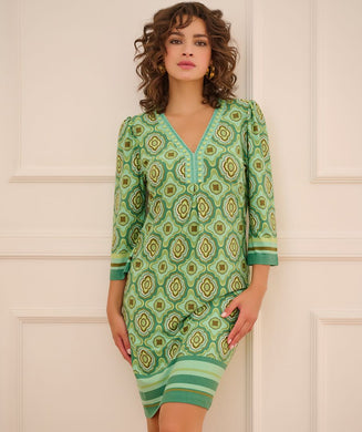 Make a fashion statement with EsQualo's best-selling dress!  This favorite has a mod inspired all-over 