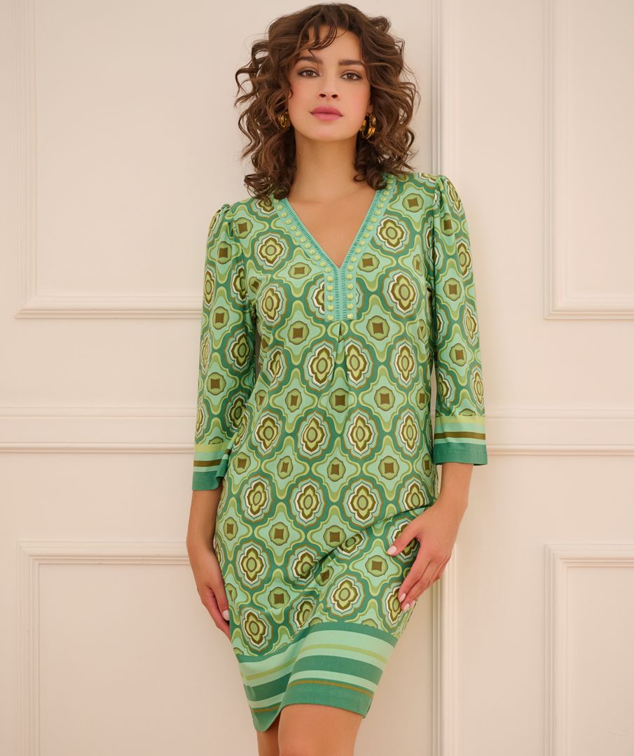 Make a fashion statement with EsQualo's best-selling dress!  This favorite has a mod inspired all-over 